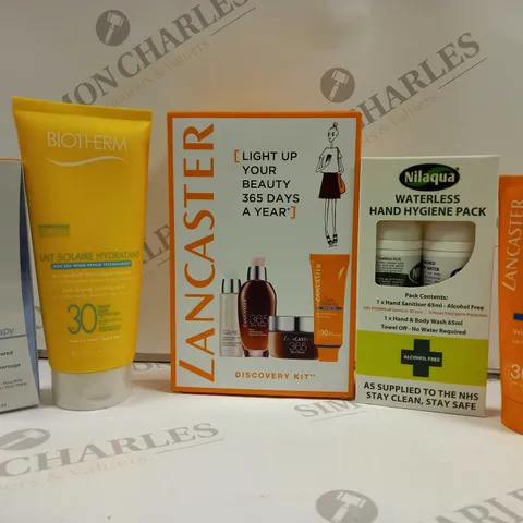 BOXED SUN & TRAVEL KIT 6 ASSORTED ITEMS TO INCLUDE - BIOTHERM LAIT SOLAIRE HYDRANTANT - LANCASTER SUN BEAUTY - NILAQUA HAND HYGIENE PACK ECT