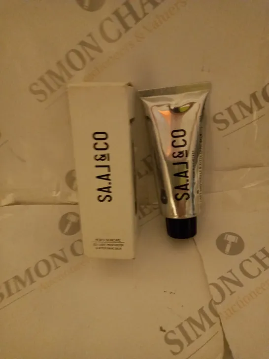 BOX OF APPROXIMATELY 25 SAAL SKINCARE 100ML TUBES OF LIGHT MOISTURIZER & AFTER SHAVE BALM