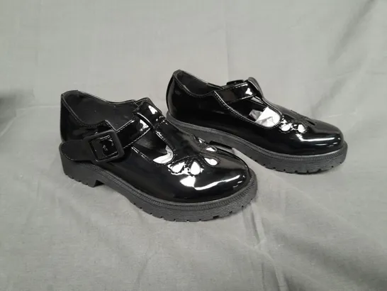 BOXED PAIR OF ENVY SIZE 31 BLACK PATENT BUCKLE TRAINER 