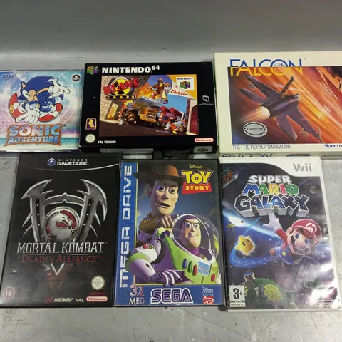 APPROXIMATELY 6 ASSORTED RETRO VIDEO GAMES TO INCLUDE FALCON, TOY STORY, MORTAL KOMBAT ETC 