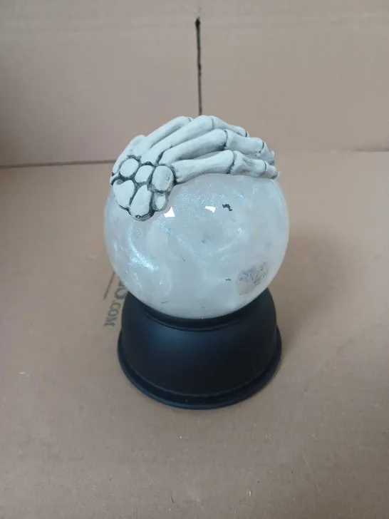 FESTIVE SKELETON HAND SNOW GLOBE 