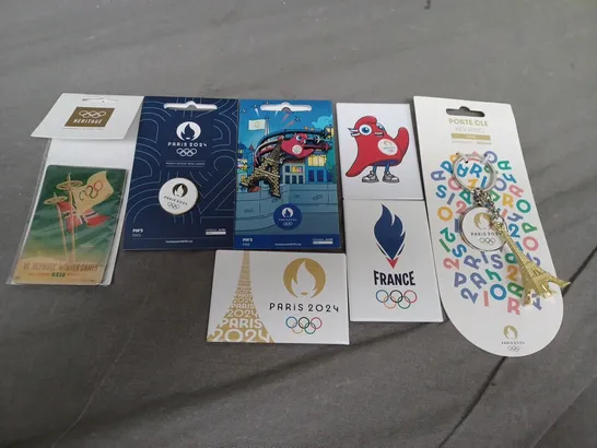 SEVEN ASSORTED ITEMS OF OLYMPICS MEMORBILIA TO INCLUDE; 2024 PIN BADGES, 2024 KEY RING AND 2024 FRIDGE MAGNETS