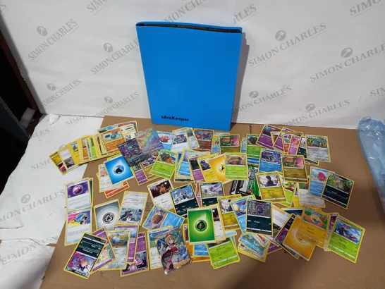 LOT OF APPROXIMATELY 60 ASSORTED POKEMON CARDS WITH MINT KEEPER BLUE CARD CASE (CARDS INCLUDE SHINT APPLETUN, GARBODOR V, SHINY UMBREON VMAX ETC)