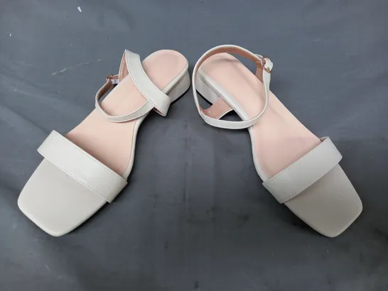 BOXED PAIR OF DESIGNER OPEN TOE LOW HEEL SANDALS IN CREAM EU SIZE 38