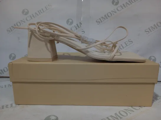 BOXED PAIR OF PUBLIC DESIRE BLOCK HEEL STRAPPY SANDALS IN CREAM SIZE 7