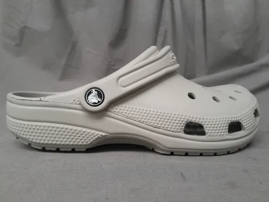 PAIR OF CROCS CLASSICS IN GREY UK SIZE M6/W7