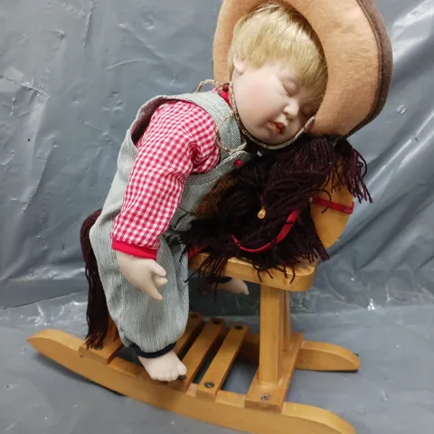 THE ASHTON-DRAKE GALLERIES ASLEEP IN THE SADDLE HAND CRAFTED DOLL WITH CERTIFICATE OF AUTHENTICITY