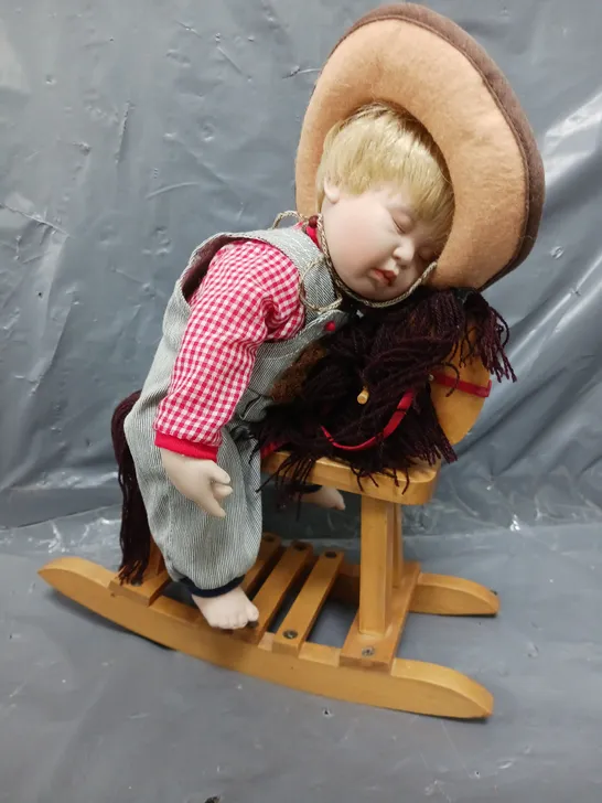 THE ASHTON-DRAKE GALLERIES ASLEEP IN THE SADDLE HAND CRAFTED DOLL WITH CERTIFICATE OF AUTHENTICITY