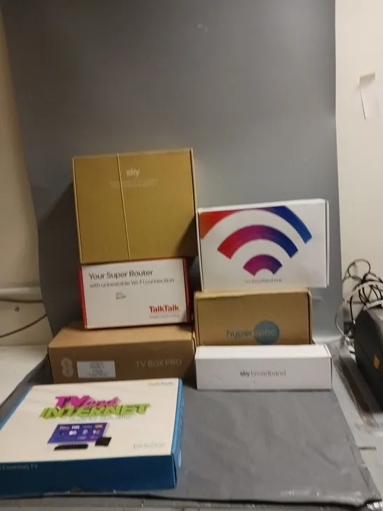 LARGE BOX OF ASSORTED BROADBAND/HOME NETWORKING ITEMS TO INCLUDE BRANDS LIKE SKY, VIRGIN, THREE, AND TALKTALK ETC.