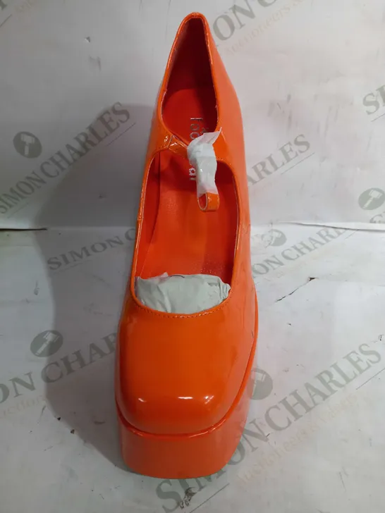 PAIR OF KOI VEGAN LEATHER HIGH HEEL SQUARED TOE PLATFORM SHOES IN A SHINY ORANGE DESIGN - SIZE 7