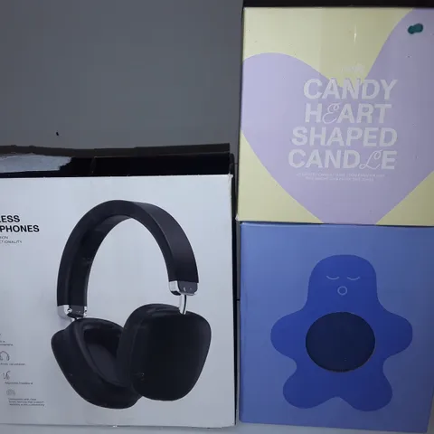 LOT OF 3 ASSORTED ITEMS TO INCLUDE WIRELESS HEADPHONES, HEART SHAPED CANDLE AND STRESS RELIEF FRIEND