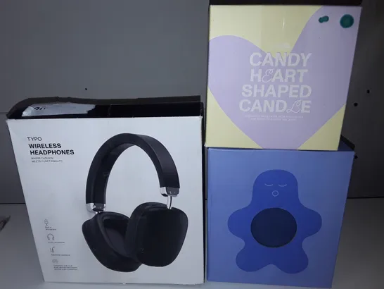 LOT OF 3 ASSORTED ITEMS TO INCLUDE WIRELESS HEADPHONES, HEART SHAPED CANDLE AND STRESS RELIEF FRIEND