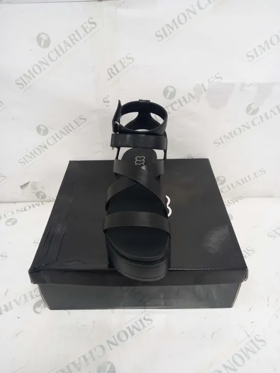 BOXED PAIR OF KOI FOOTWEAR CRIX CHUNKY BLATFORM SANDALS IN BLACK PU - SIZE 6