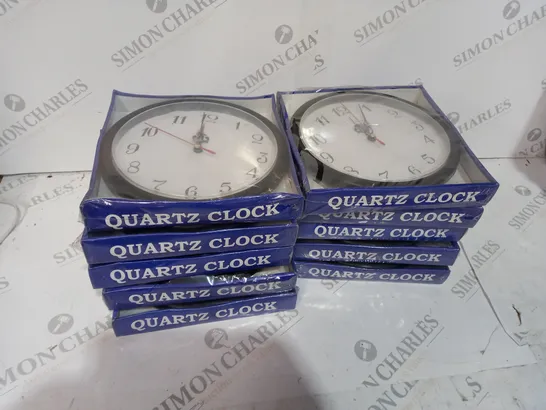 BOX OF APPROX 10 SMALL BLACK QUARTZ CLOCKS