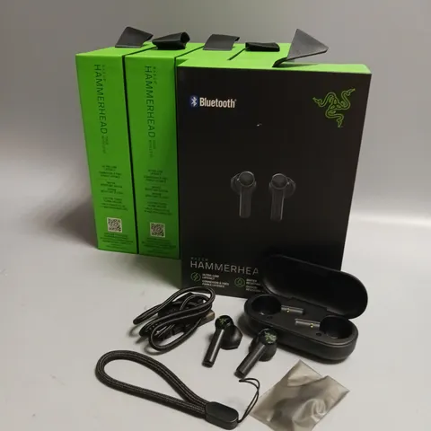 LOT OF 5 BOXED RAZER WIRELESS HEADPHONES IN BLACK AND GREEN INCLUDES CHARGING CASE, CABLE AND WRIST STRAP