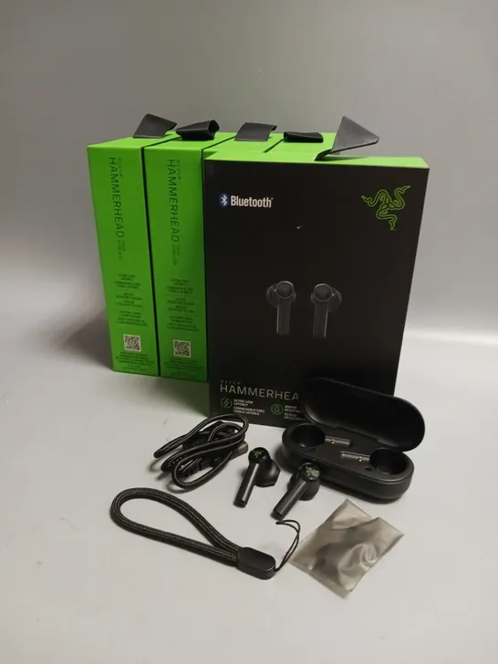 LOT OF 5 BOXED RAZER WIRELESS HEADPHONES IN BLACK AND GREEN INCLUDES CHARGING CASE, CABLE AND WRIST STRAP