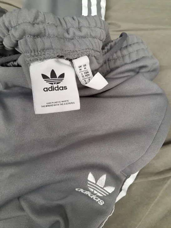 ADIDAS STRIPED JOGGERS IN GREY - UK M