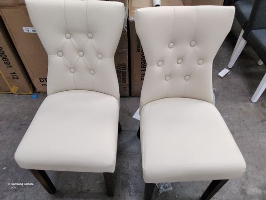 2 DESIGNER CREAM/ WHITE FAUX LEATHER CHAIRS WITH BUTTONED BACKS ON WOODEN LEGS 