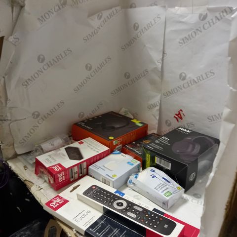 LOT OF APPROXIMATELY 10 ASSORTED ITEMS INCLUDING TV REMOTES , HEADPHONES , AND PHONE CHARGERS 