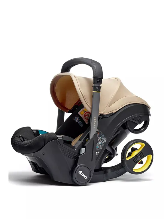 DOONA DOONA-I INFANT CAR SEAT & STROLLER - SAHARA SAND - COLLECTION ONLY 