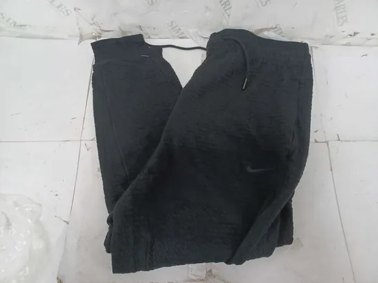 NIKE YOGA DRI-FIT BOTTOMS IN BLACK - MEDIUM