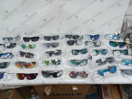 APPROXIMATELY 30 REEBOK ONE SIZE SPORT GLASSES OF VARIED COLOURS 