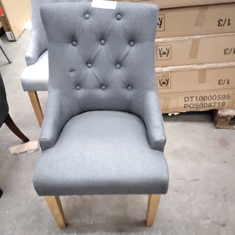 DESIGNER GREY FABRIC CHAIR WITH BUTTONED BACK AND SMALL ARM RESTS ON WOODEN LEGS