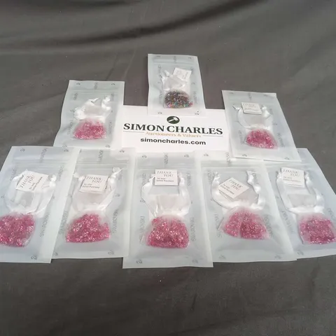 EIGHT ASSORTED BAGS OF SWAROVSKI GEMS