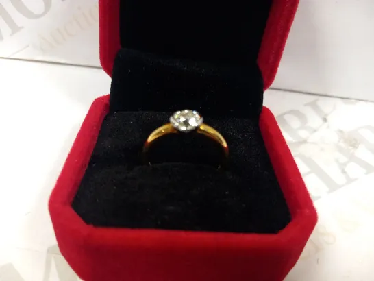 18CT GOLD SOLITAIRE RING SEMI RUB OVER SET WITH A DIAMOND WEIGHING +0.73CT