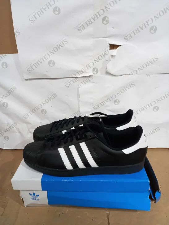 BOXED PAIR OF ADIDAS SUPERSTARS IN BLACK SIZE 19