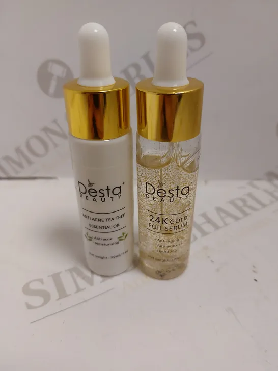 BOX OF 2 DESTA BEAUTY ITEMS TO INCLUDE ANTI ACNE TEA TREE ESSENTIAL OIL AND 24K GOLD FOIL SERUM