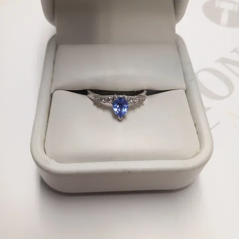 DESIGNER 18CT WHITE GOLD RING SET WITH A PEAR SHAPED TANZANITE WITH DIAMOND SET SHOULDERS