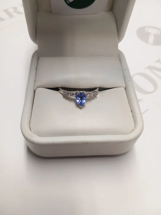 DESIGNER 18CT WHITE GOLD RING SET WITH A PEAR SHAPED TANZANITE WITH DIAMOND SET SHOULDERS