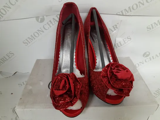 BOXED PAIR OF OCCASSIONS BY CASANDRA OPEN TOE ROSE DETAIL HEELS IN RED - SIZE 5