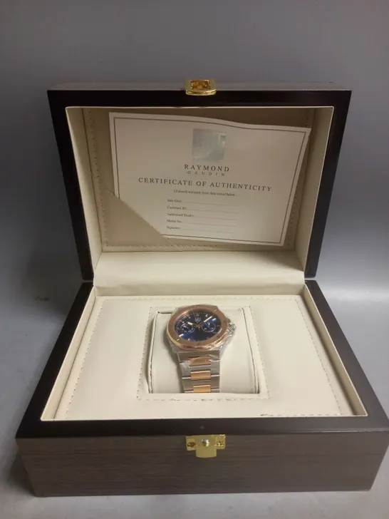 BOXED RAYMOND GAUDIN WATCH IN BLUE/GOLD/SILVER