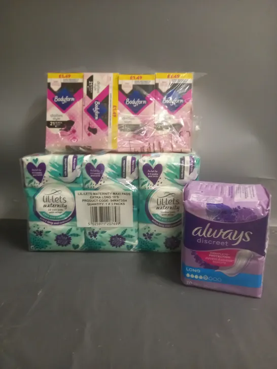 APPROXIMATELY 12 PACKS OF FEMININE HYGIENE AND INCONTINENCE PADS