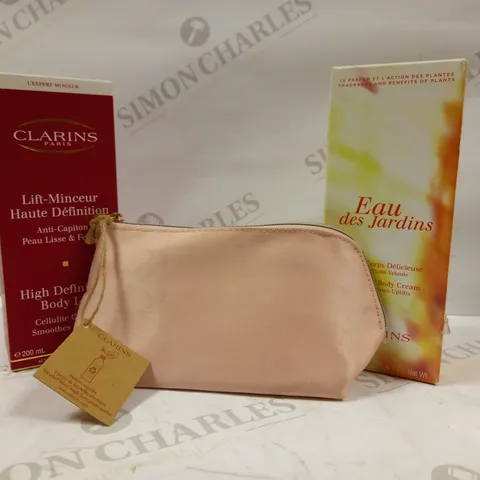 LOT OF APPROX 6 CLARINS PARIS SKIN CARE PRODUCTS TO INCLUDE SMOOTHING BODY CREAM, HIGH DEFINITION BODY LIFT, MINI GIFT BAG 