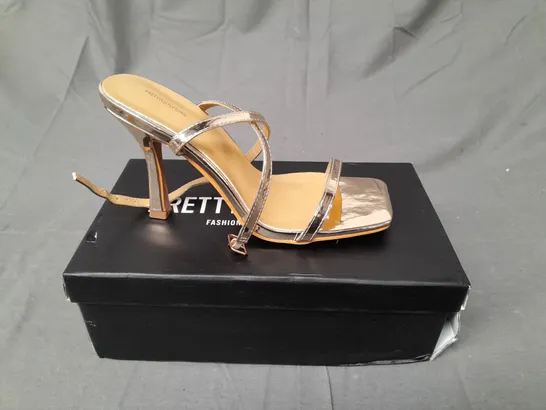 BOXED PAIR OF PRETTY LITTLE THING HEELS IN GOLD METALLIC SIZE UK 5