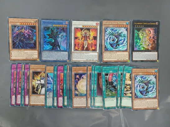 SMALL ASSORTMENT OF YU-GI-OH COLLECTIBLE TRADING CARDS TO INCLUDE MAGICIAN OF CHAOS, LAVALVAL EXLORD, GLACIER AQUA MADOOR, ETC