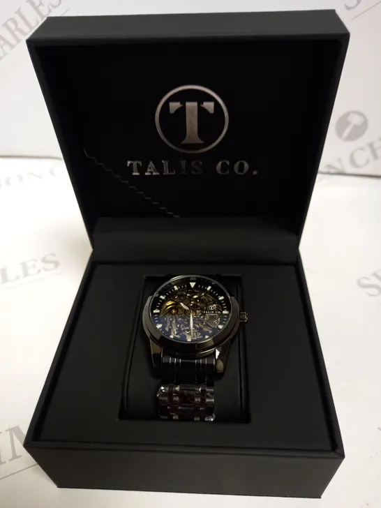 MEN’S TALIS CO 7820 AUTOMATIC WATCH – BLACK SKELETON DIAL AND CASE – STAINLESS STEEL STRAP – GLASS BACKCASE.