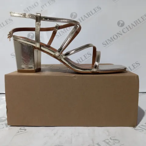 BOXED PAIR OF WHERE'S THAT FROM OPEN TOE STRAPPY BLOCK HEEL SANDALS IN METALLIC GOLD UK SIZE 5