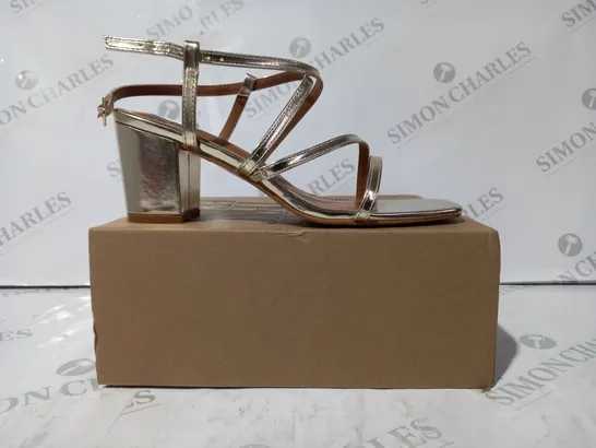 BOXED PAIR OF WHERE'S THAT FROM OPEN TOE STRAPPY BLOCK HEEL SANDALS IN METALLIC GOLD UK SIZE 5