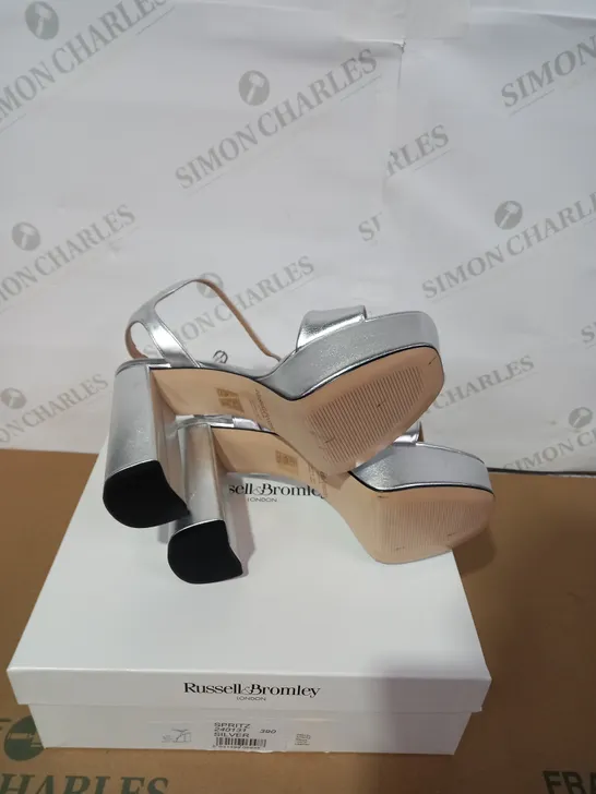BOXED PAIR OF RUSSELL & BROMLEY SILVER HIGH HEELS SIZE 39