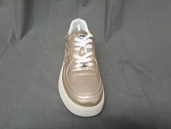 BOXED PAIR OF CHANEL SNEAKERS IN GOLD EU SIZE 39