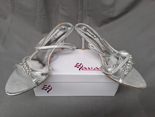 BOX OF APPROXIMATELY 20 PAIRS OF LAVANDA OPEN TOE STRAPPY HEELED SANDALS IN METALLIC SILVER IN VARIOUS SIZES