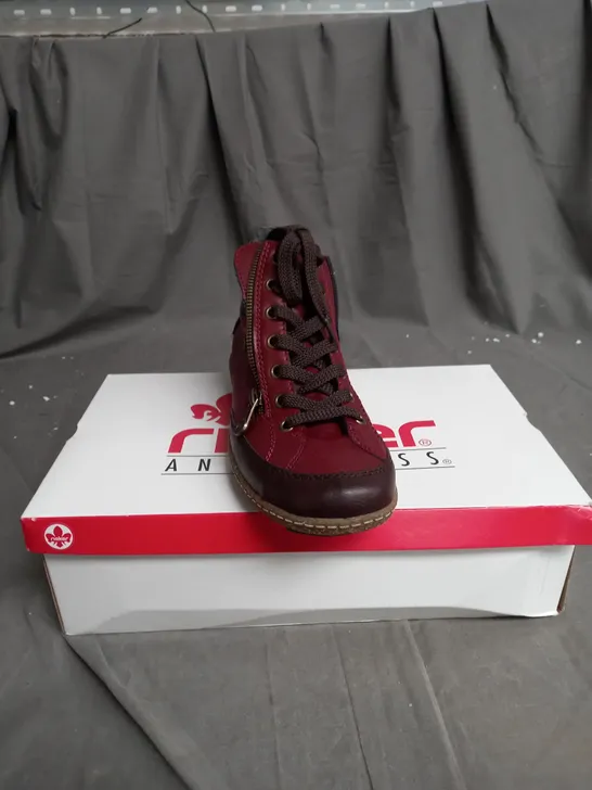 BOXED PAIR OF RIEKER SIDE ZIP WATER RESISTANT BOOTS IN BURGUNDY SIZE 6