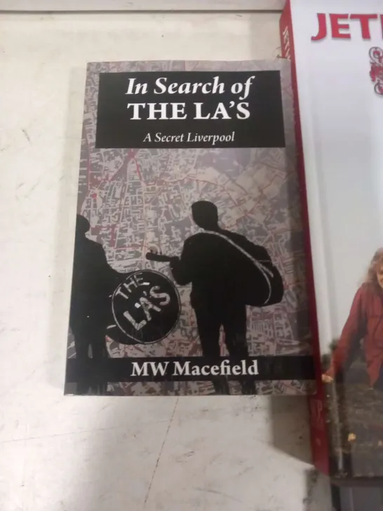 APPROXIMATELY SIX ASSORTED MUSIC BOOKS TO INCLUDE; BEATLES ANNIVERSARY MAGAZINE, JETHRO TULL CHRONICLES 1967-79, CUREPEDIA, BTS BEYOND THE STORY, I AM HATED FOR LOVING DICKIE FELTON AND IN SEARCH OF T