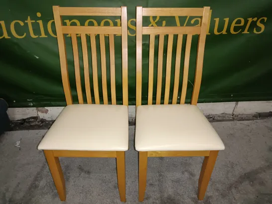 PAIR OF WOODEN SLAT BACK DINING CHAIRS WITH CREAM FAUX LEATHER SEAT PADS 