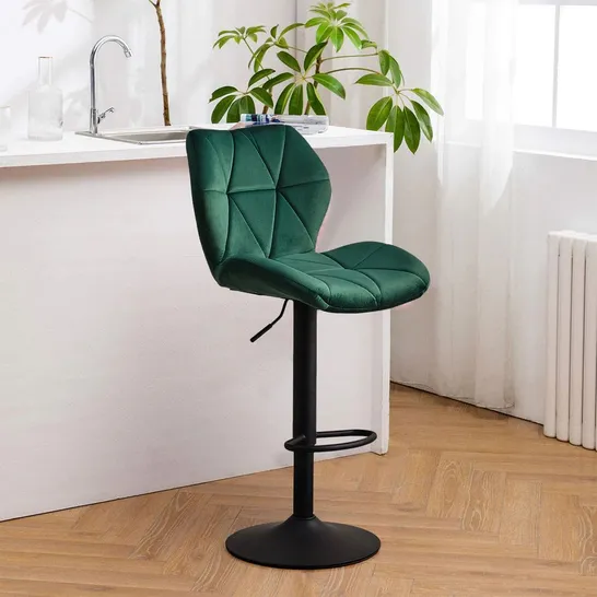 A BOXED PAIR OF CRUSHED VELVET BAR STOOLS IN GREEN