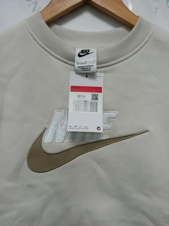 NIKE KIDS RAISED LOGO JUMPER IN CREAM - LARGE